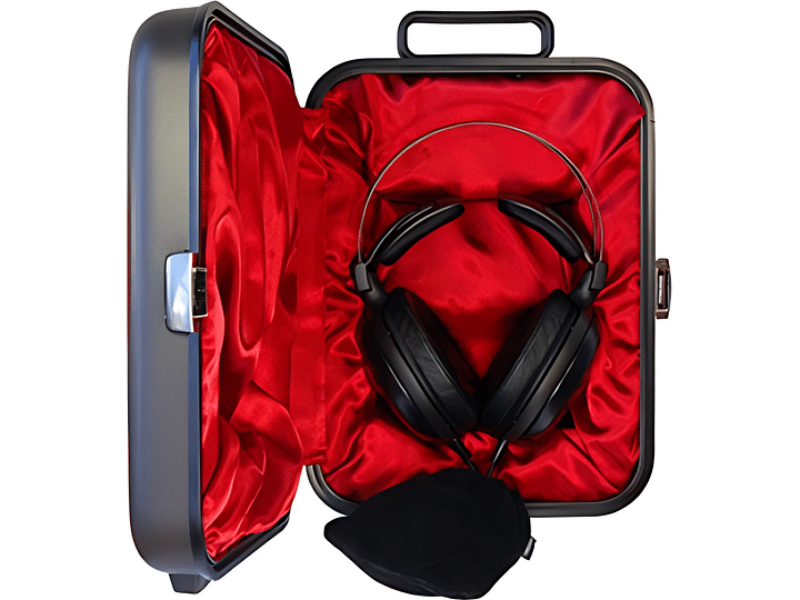 Valise rigide ouverte rouge à l'intérieur, noire à l'extérieur, avec casque audio noir à coussinets d'oreille rouges