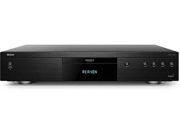 Lecteur Blu-ray 4K Reavon UBR-X100 noir, vue de face, affichage "REAVON" sur écran LED, boutons et ports sur la façade