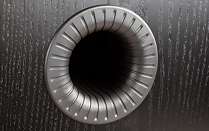 Turbine métallique circulaire vue de face, surface striée en spirale, trou noir au centre, sur fond gris foncé texturé