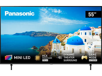 Téléviseur Panasonic TX-55MX950E 55 pouces, écran bleu affichant caractéristiques techniques sur fond de paysage méditerranéen