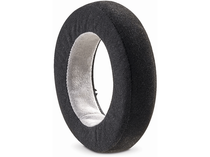 Pneu noir en mousse à mémoire de forme avec une découpe ovale au centre révélant l'intérieur gris clair du pneu